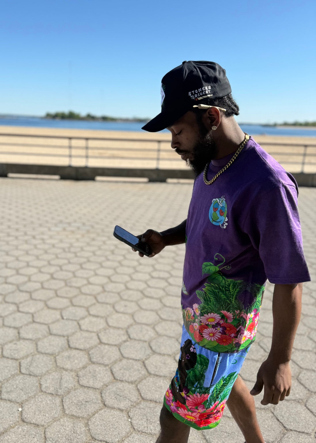 Purple Gaia tee and shorts by the waterfront