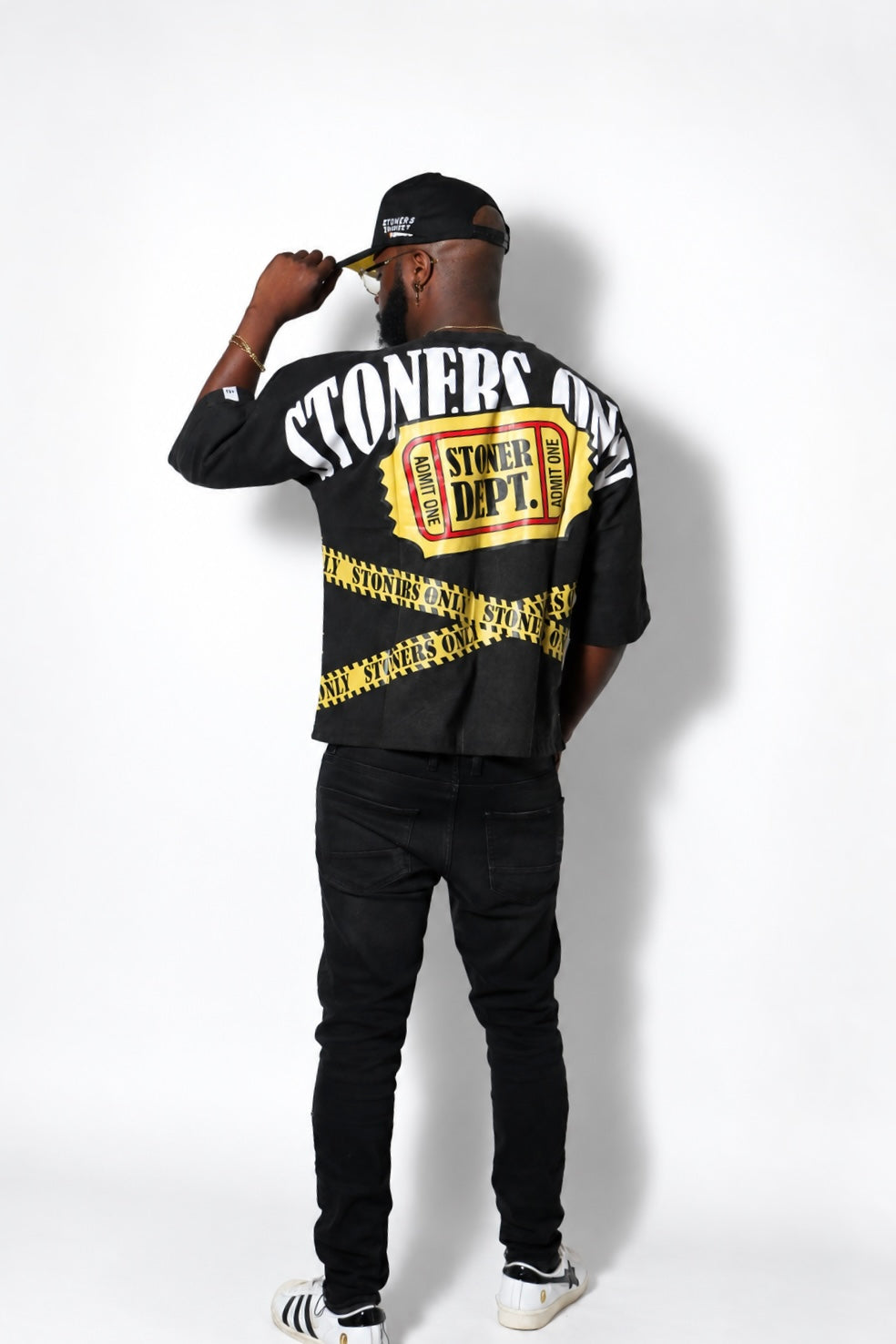 Stoner Dept ticket artwork on the back of the black Kaution tee