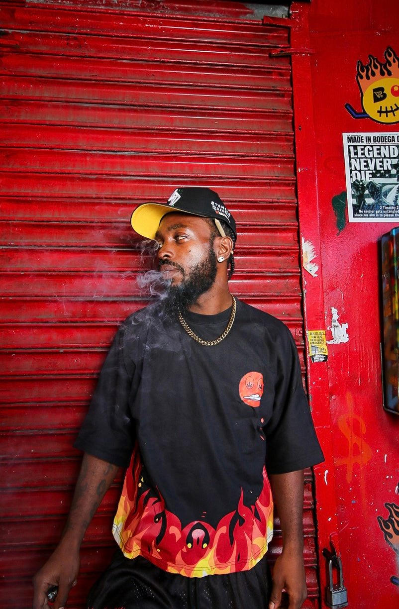 Mars tee styled in front of a red storefront