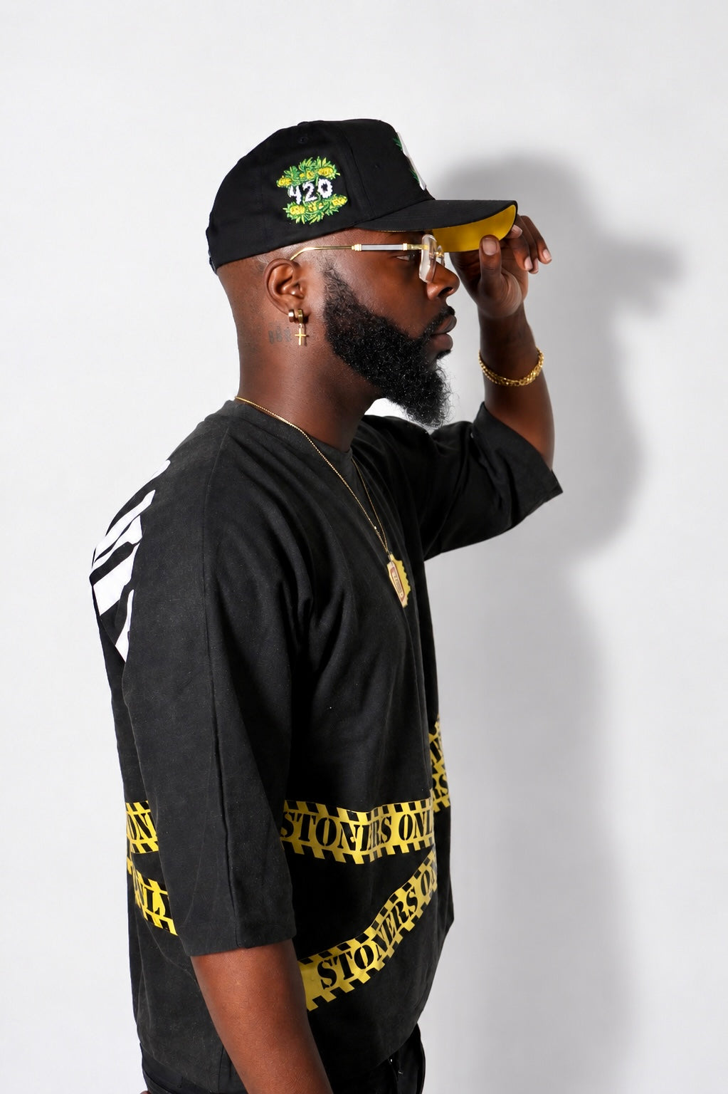Side view of the black Kaution tee and caution band